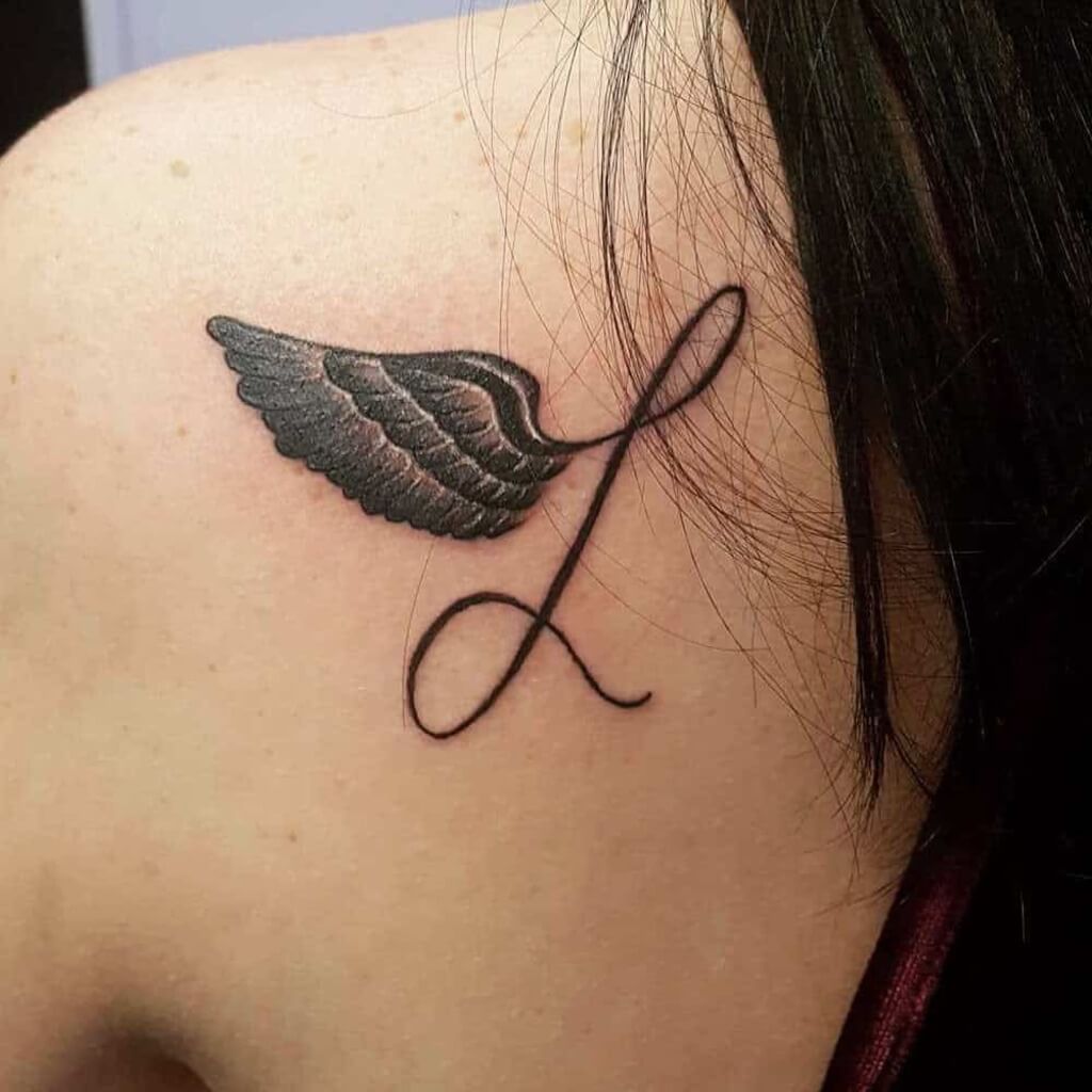 angel wings tattoo on shoulder
