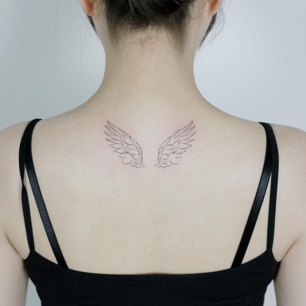 cute angel wings tattoo on back