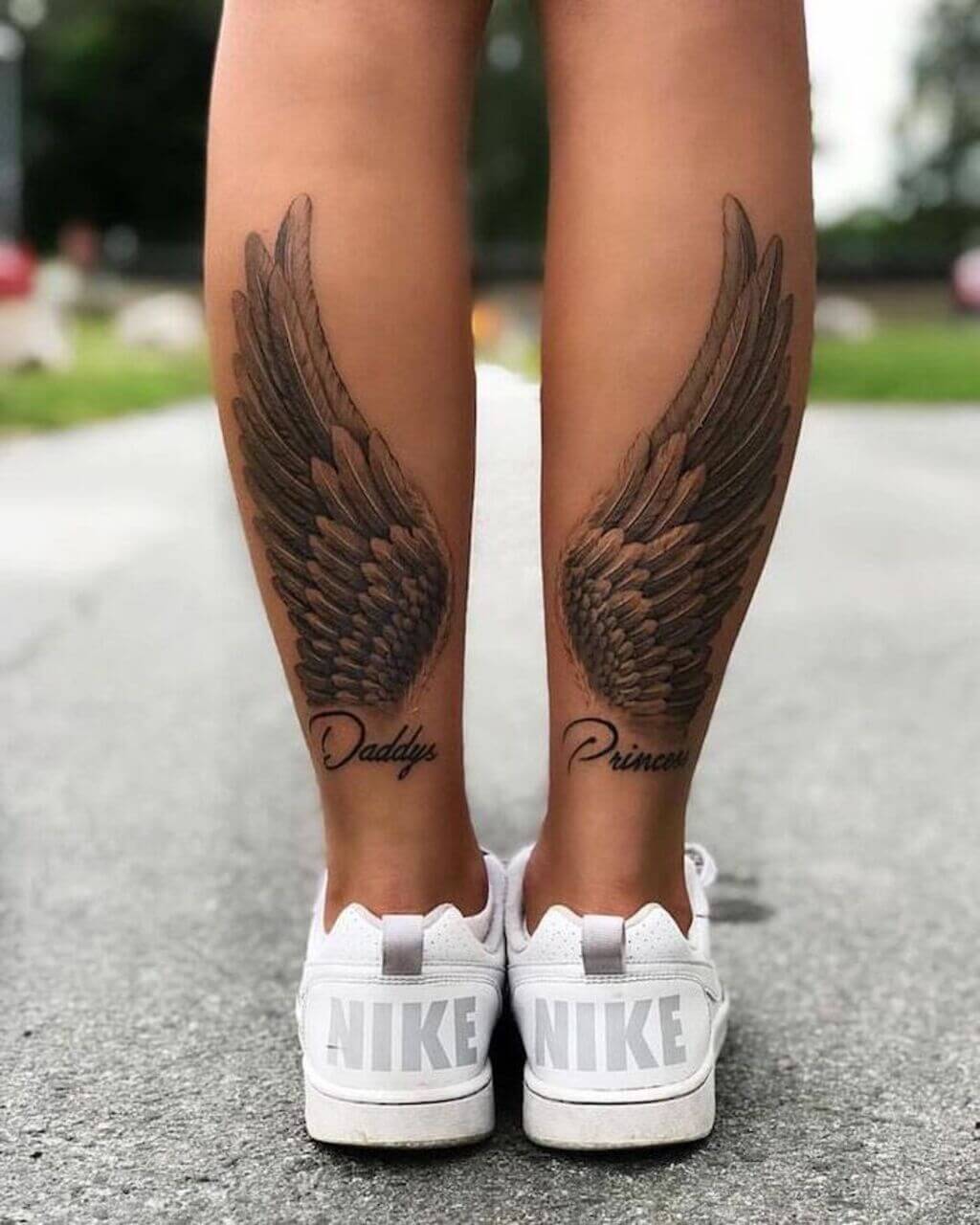 angel wings tattoo on legs