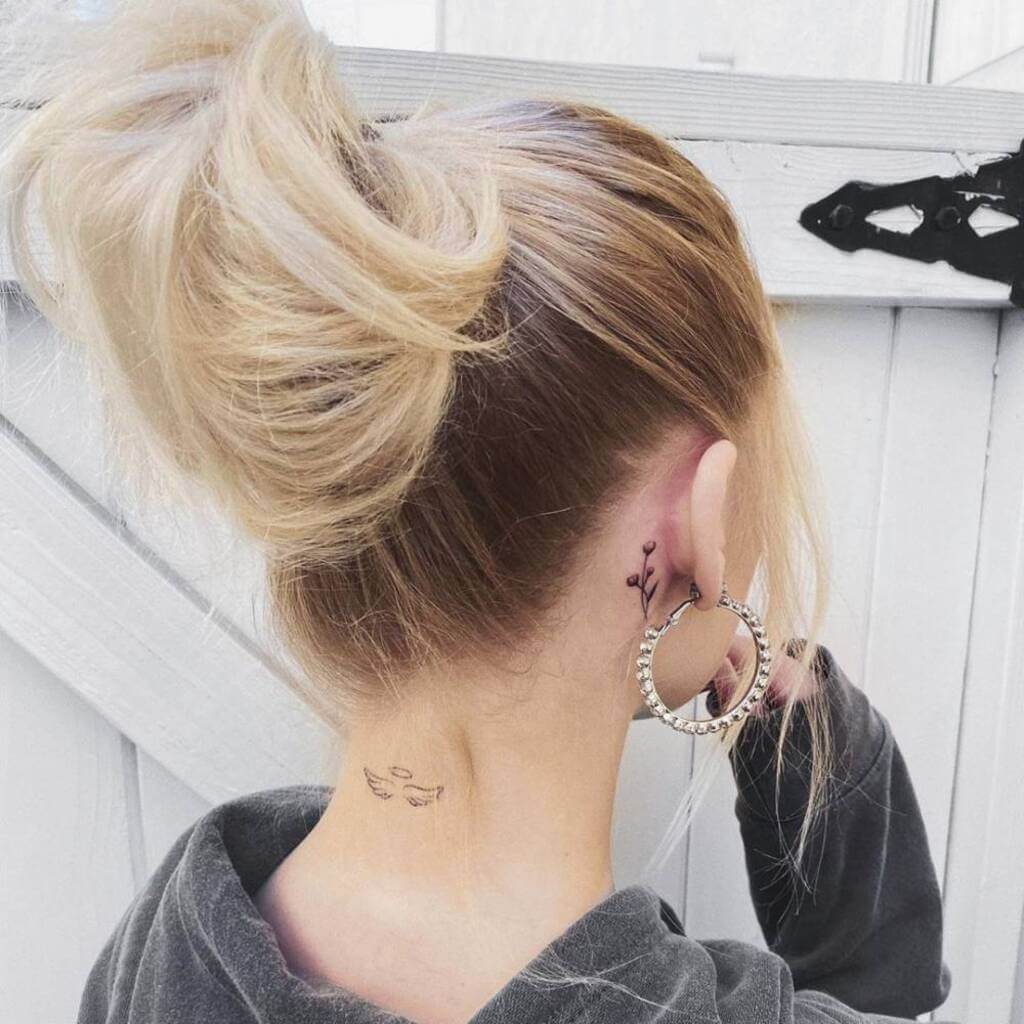 wing tattoo on neck