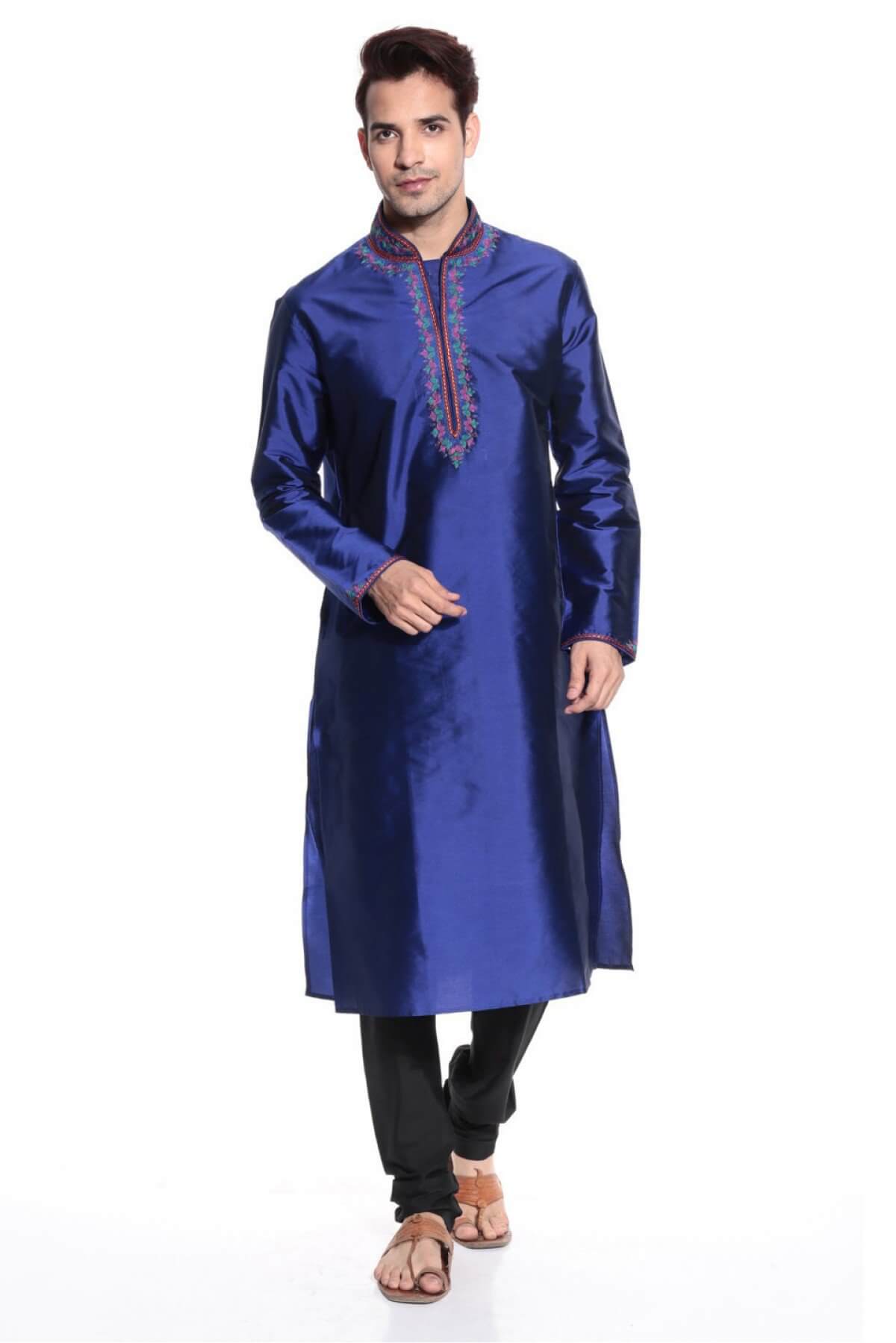A man in a blue indian outfit
