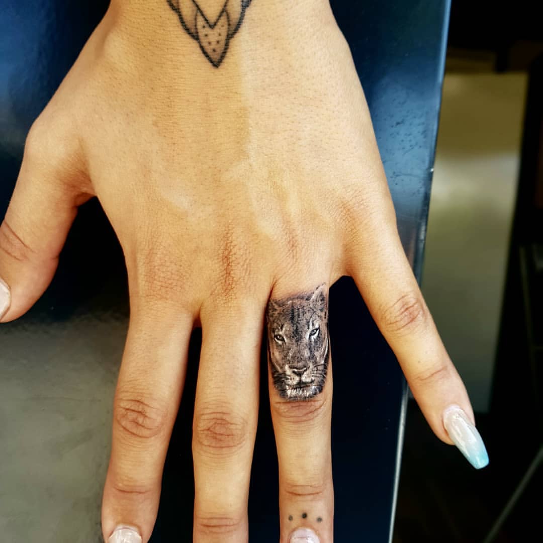 Lion tattoo on the finger