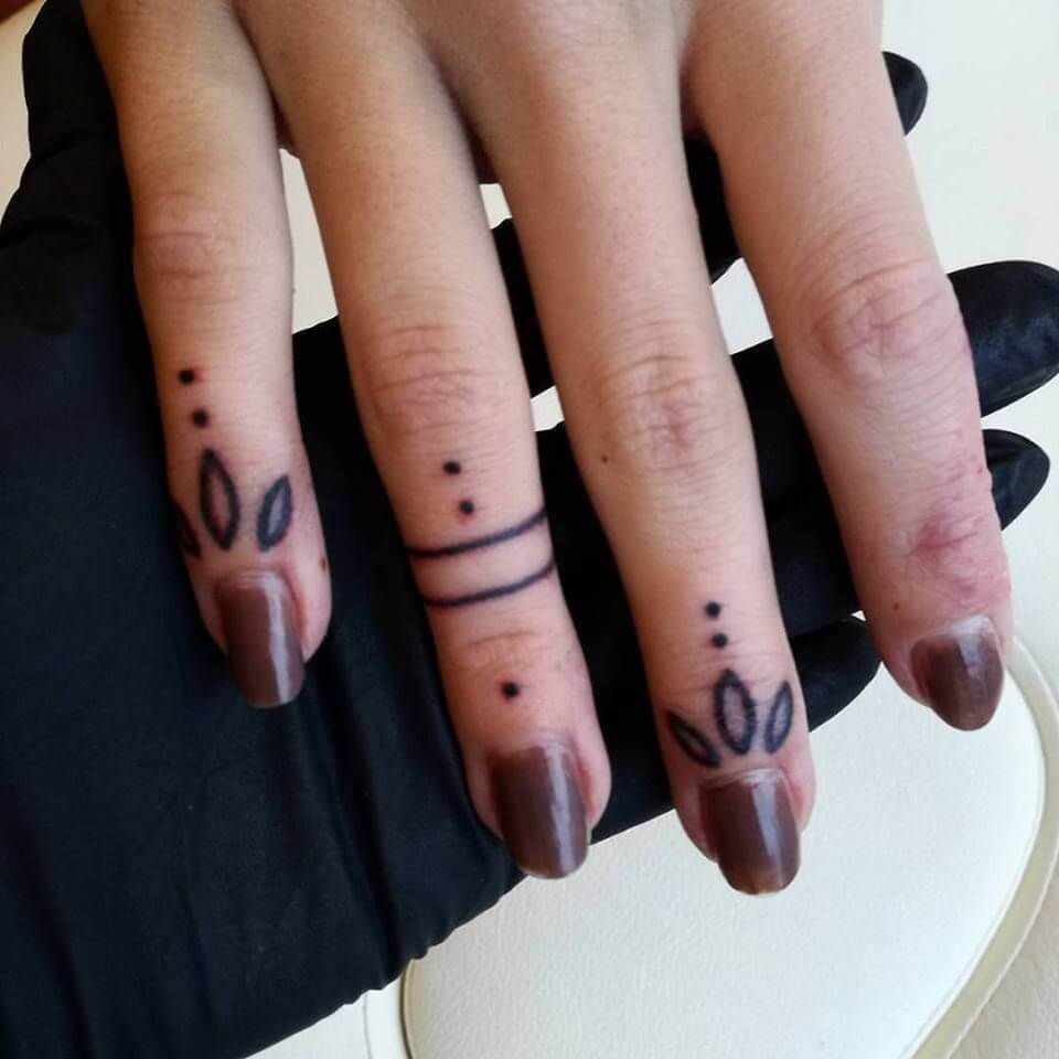 Petals And Dot All Over Finger Tattoos