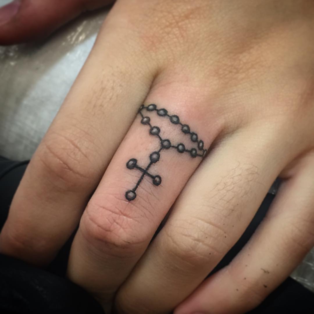 Cross Theme Ring Finger Tattoos