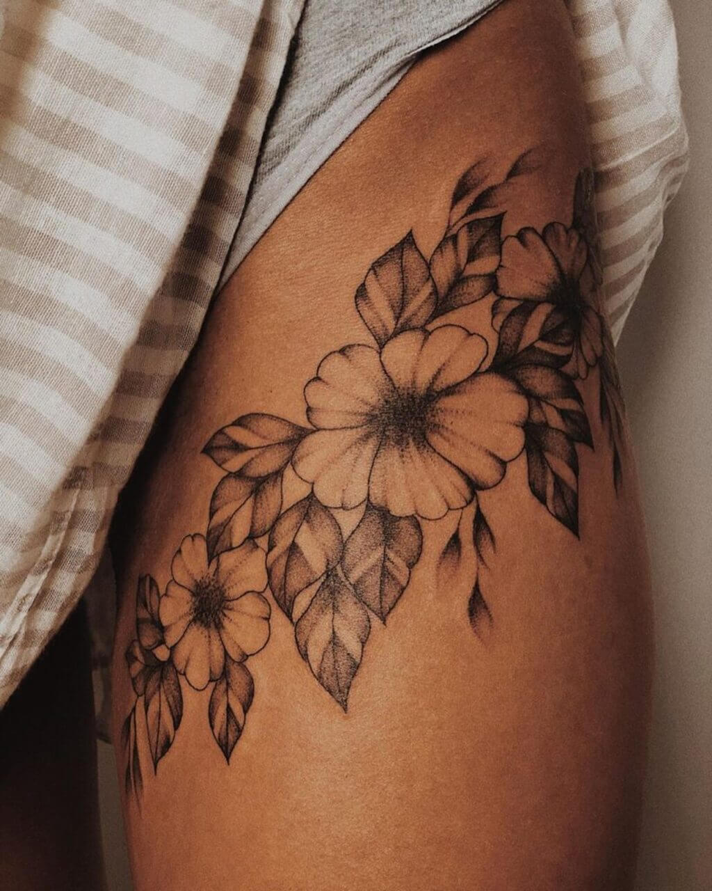 flower side thigh tattoos for females