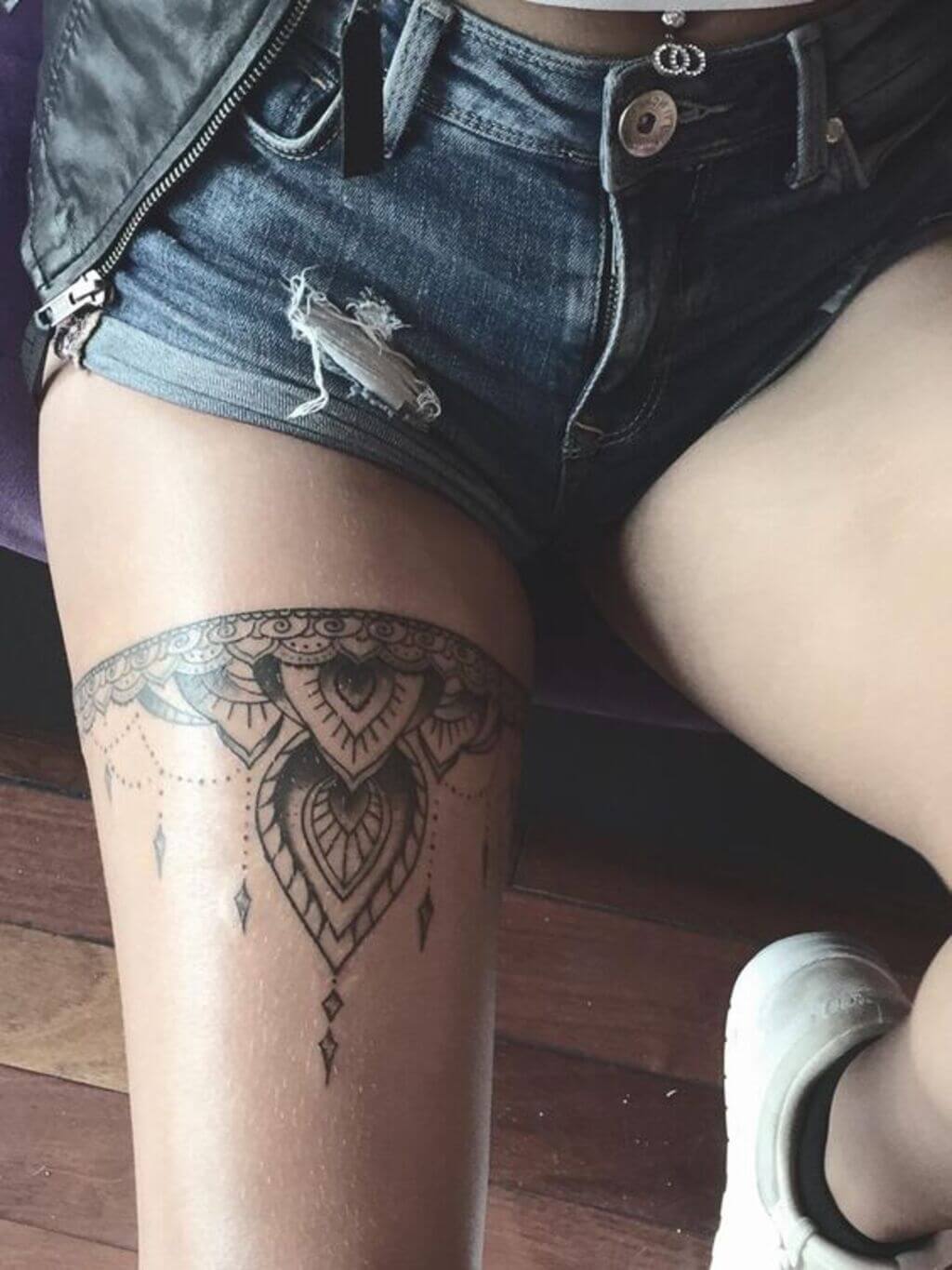 Small Front Thigh Tattoo
