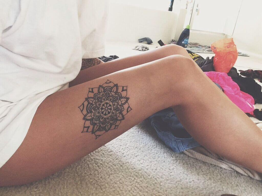 unique thigh tattoo