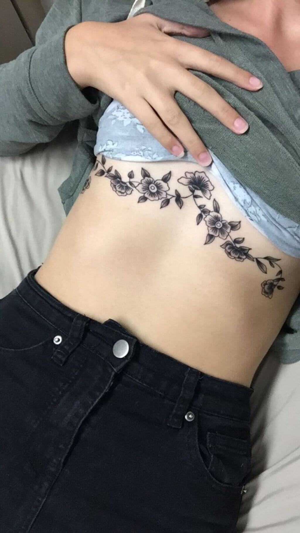 Flower tattoo under breast 