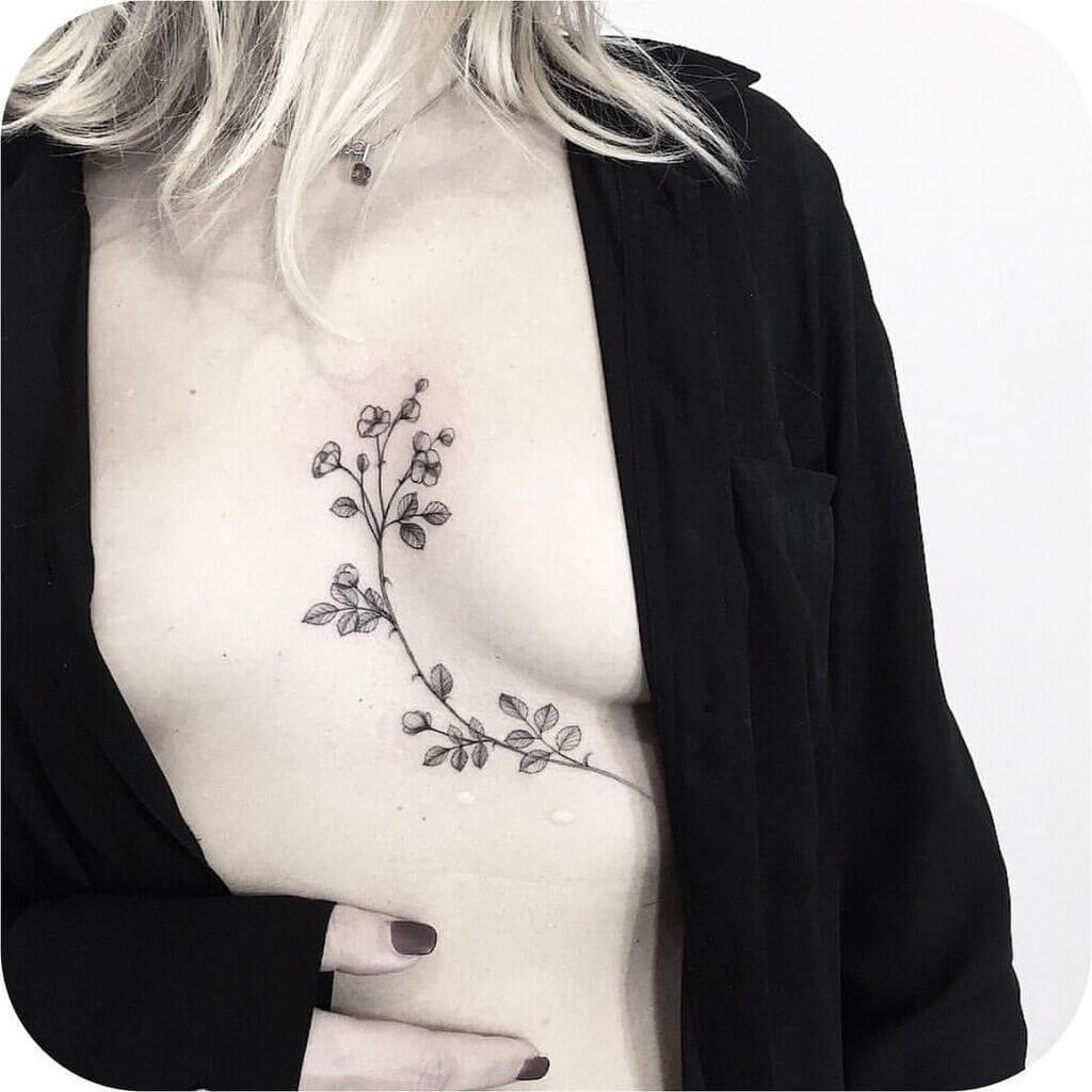 Flower design female breast tattoos 