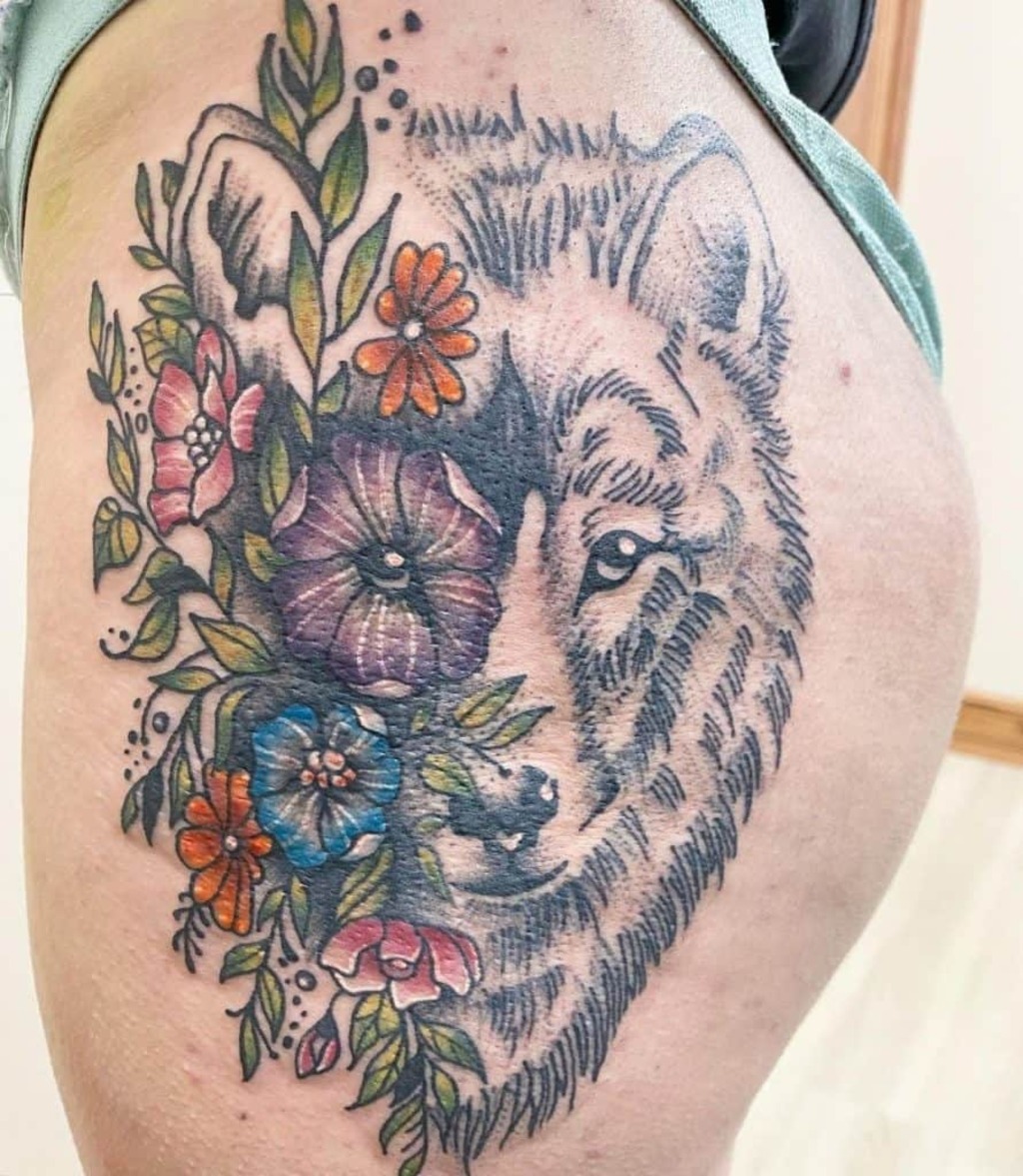 Wolf with flower hip tattoo for girls