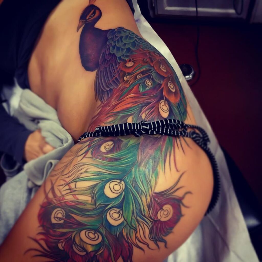 Peacock hip tattoo for girls