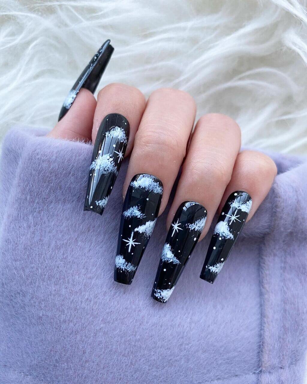 A woman with black and white nail polish 