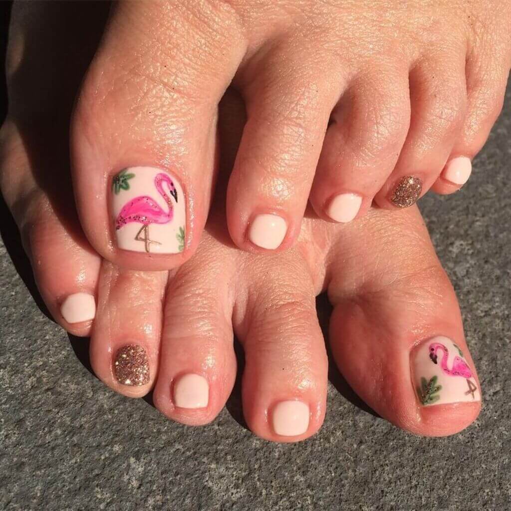 A pair of feet with flamingos on them

