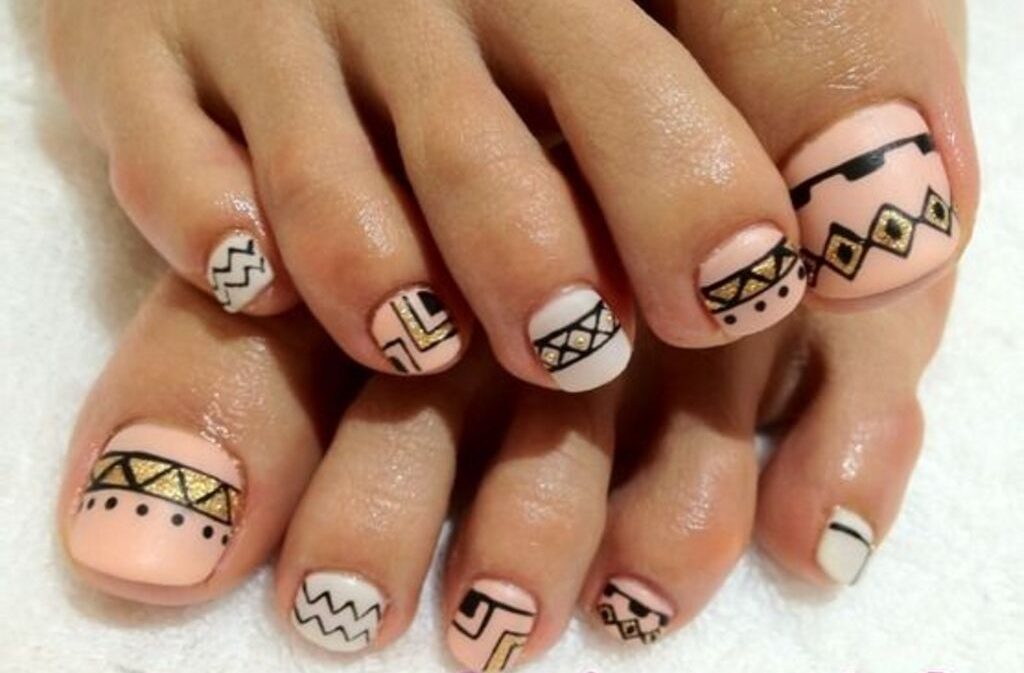 Tribal Toenail Designs with golden color