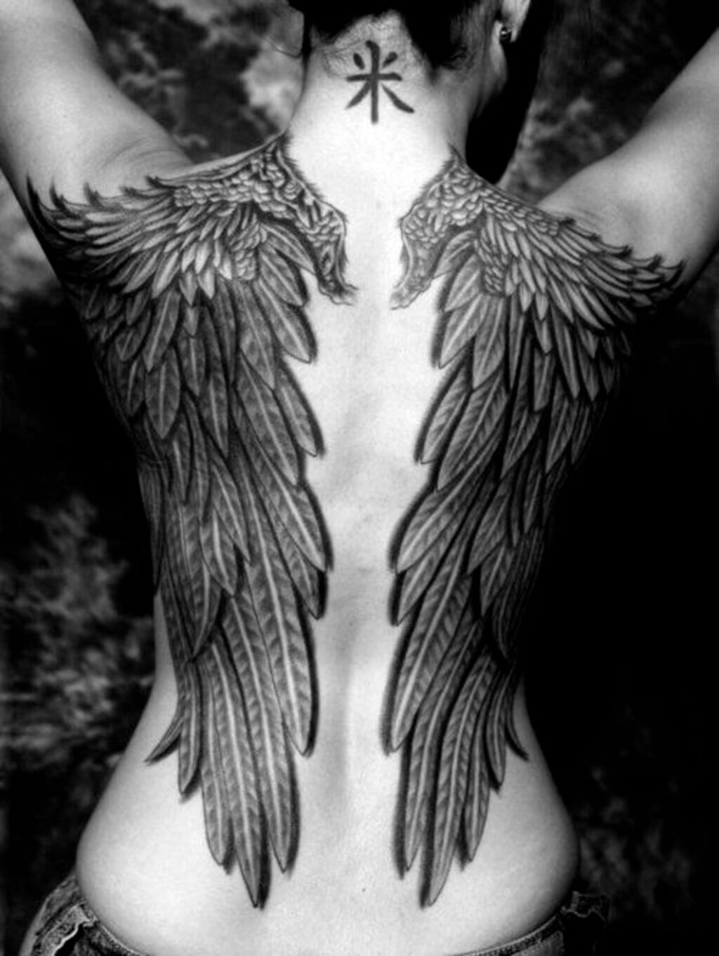 angel wings on back tattoo