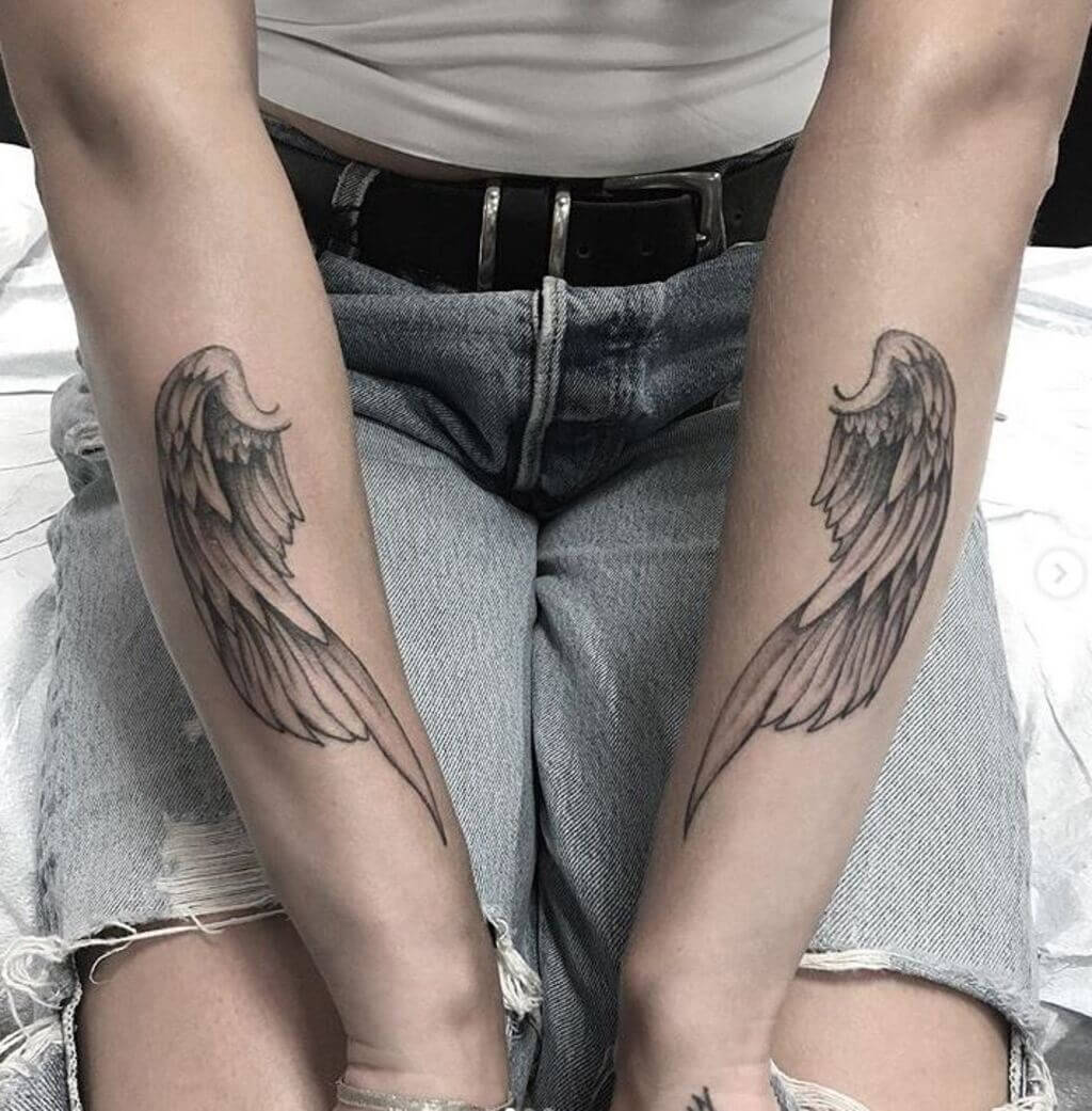 wing tattoo forearm