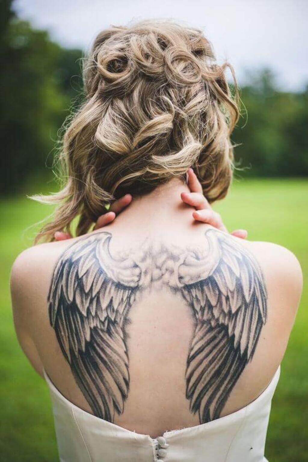 angel wings tattoo on back