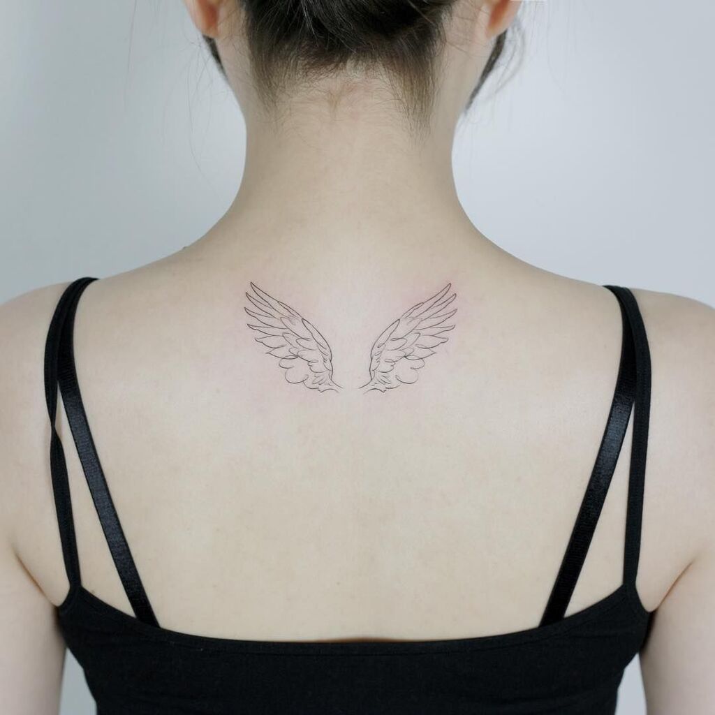 angel wings tattoo on back