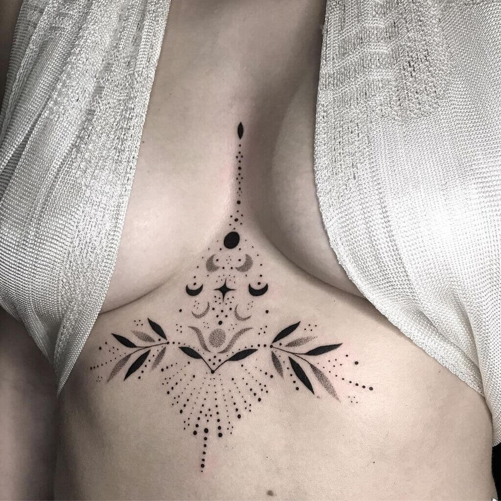 sun and moon tattoo on breast 