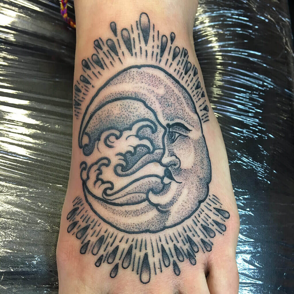 sun and moon tattoo on foot 