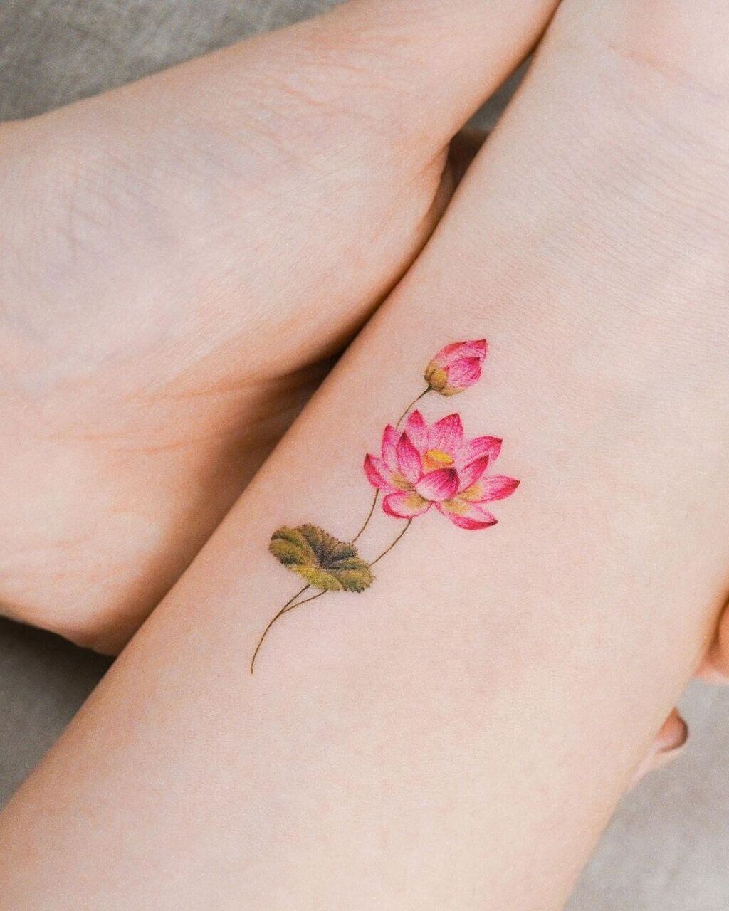 A woman' with small cherry blossom tattoo