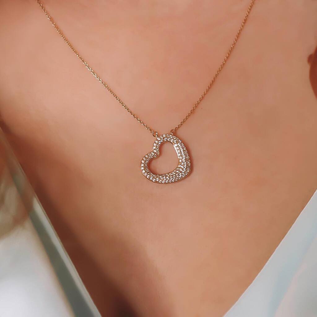  person wearing a necklace with a heart 