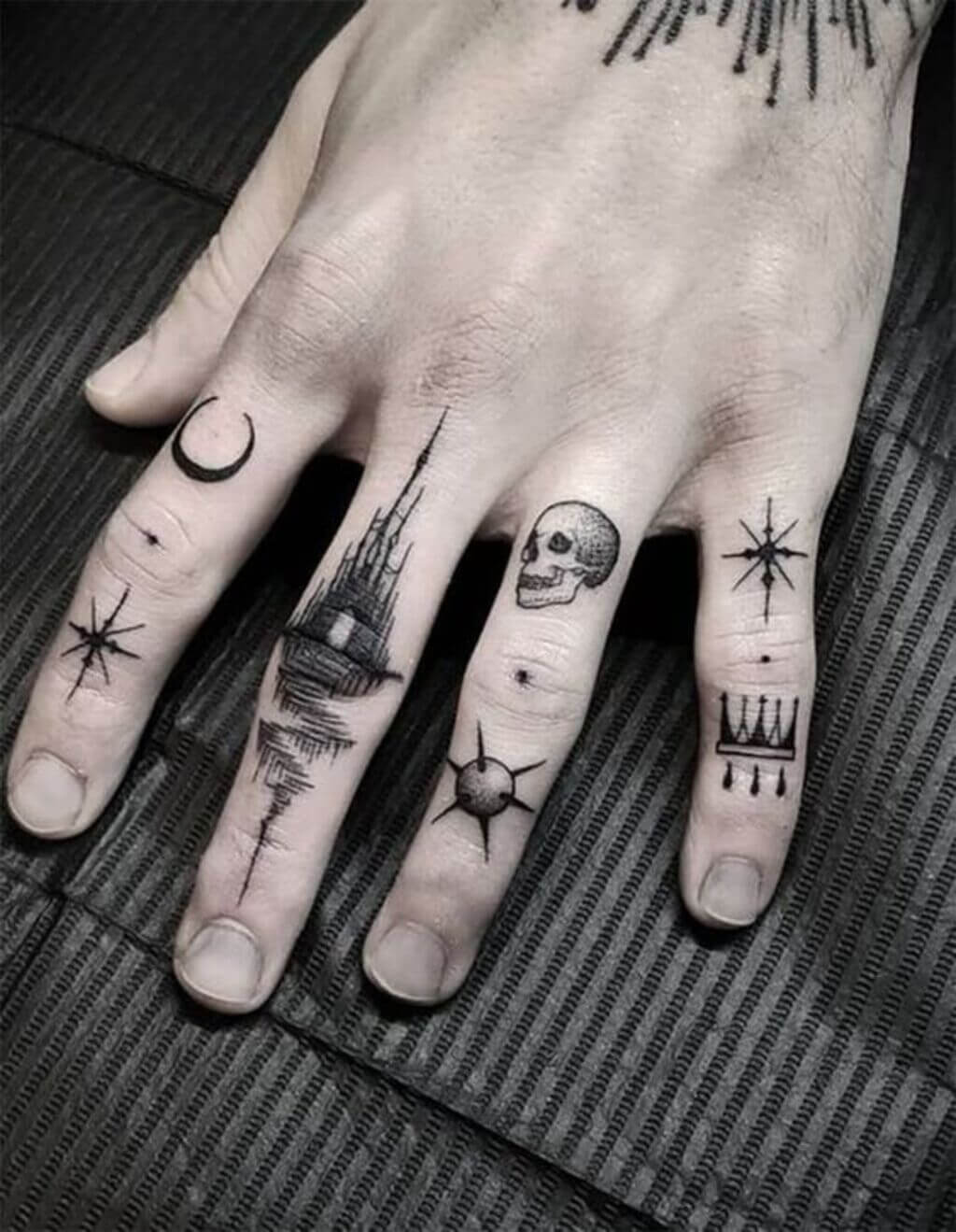 Small Finger Skull Tattoo
