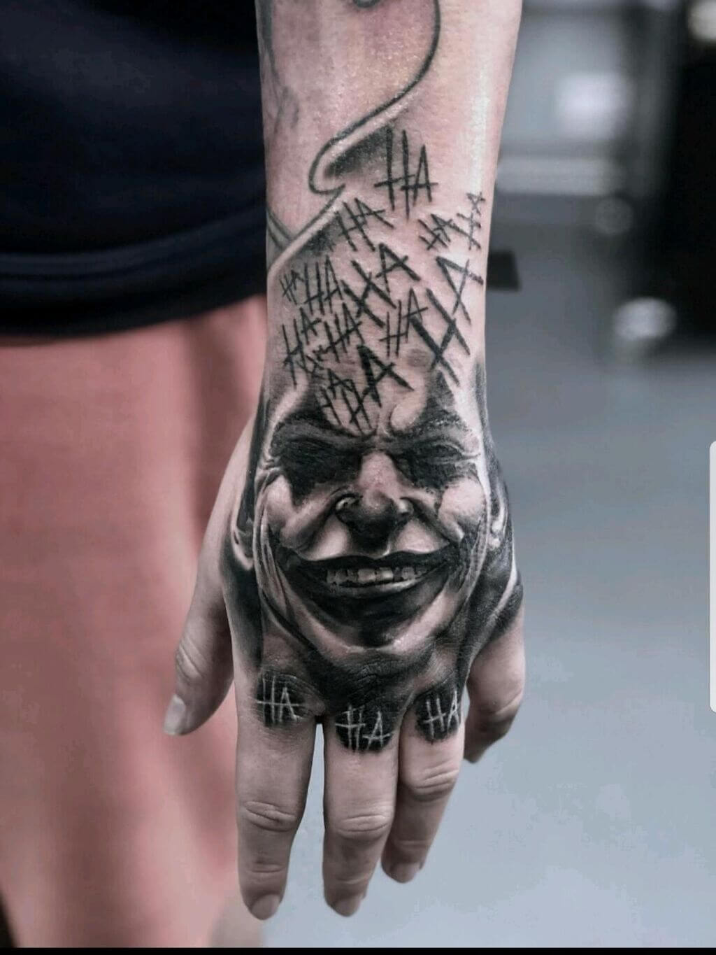 Joker-Inspired Hand Tattoos for Men