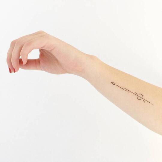 Arrow hand tattoo