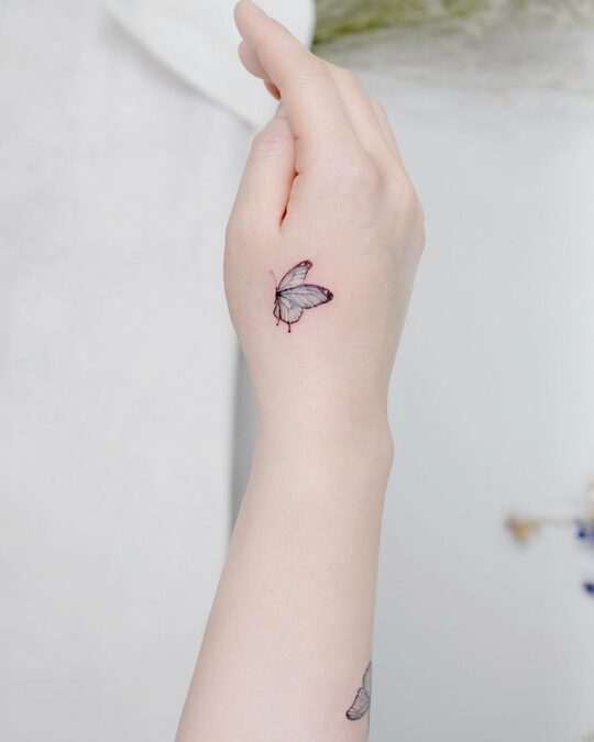 Butterfly hand tattoo