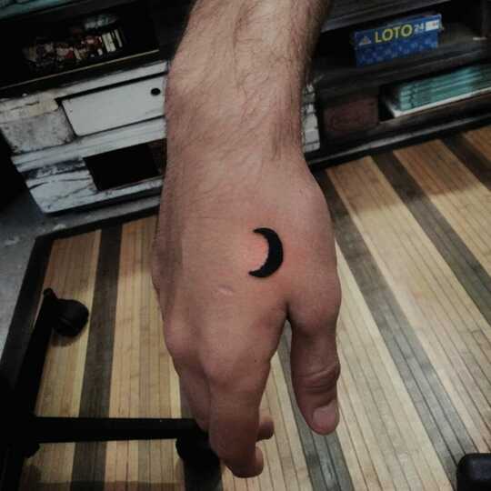 Crescent Moon tattoo on hand for men