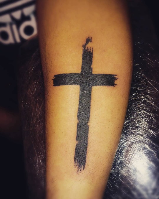 Cross hand tattoo