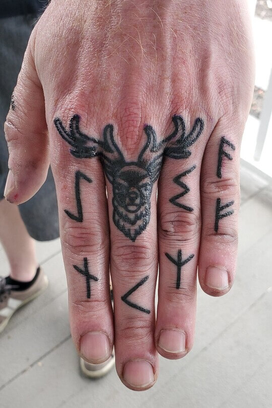 Deer tattoo on hand men