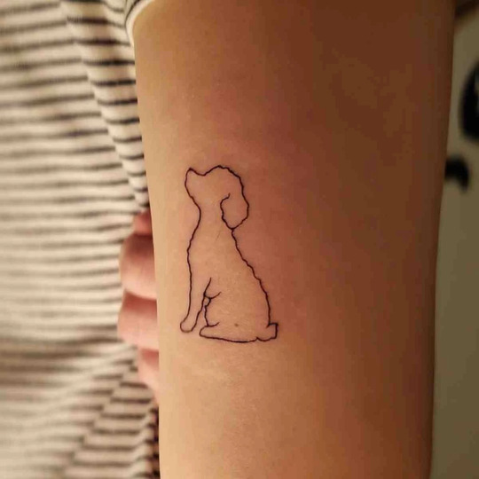 Dog hand tattoo