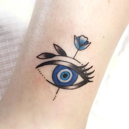 Evil eye hand tattoo