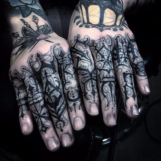 Gothic tattoo on hand for men