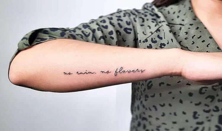 Hand tattoo with quote