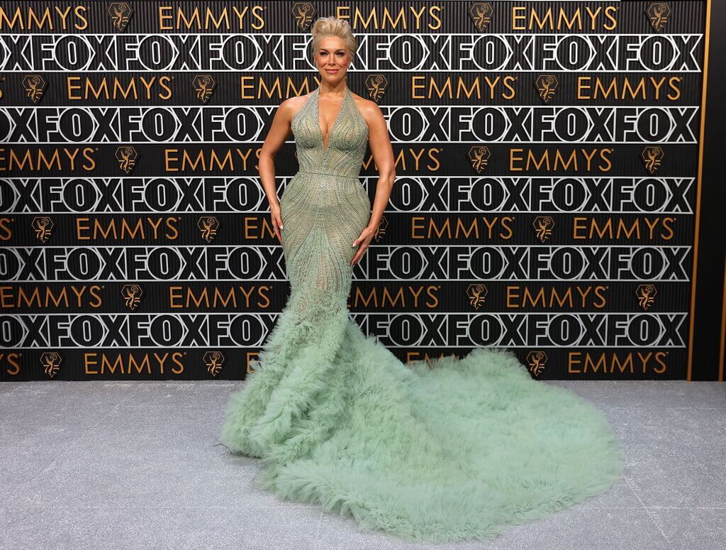 Hannah Waddingham in a soft mint green beaded Marchesa gown with ruffled tulle train