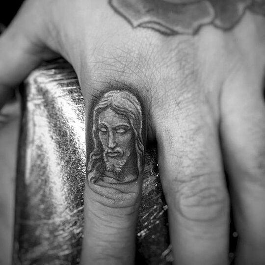Jesus Christ tattoo on finger hand for men