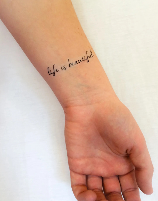 Life Is Beautiful tattoo on hand for men