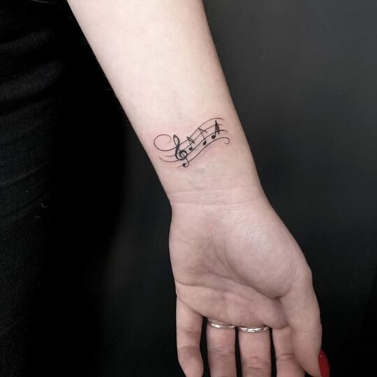 Music notes tattoo
