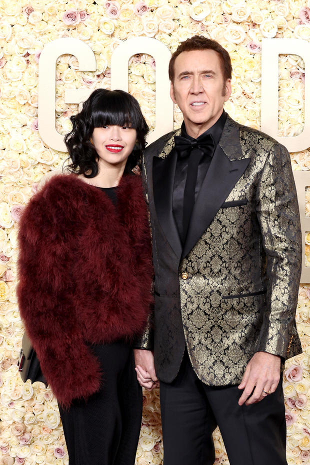 Nicholas Cage and Riko Shibata attend the 81st Annual Golden Globe Awards 