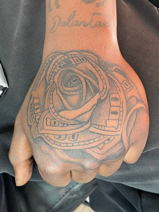 Rose and money hand tattoo for men