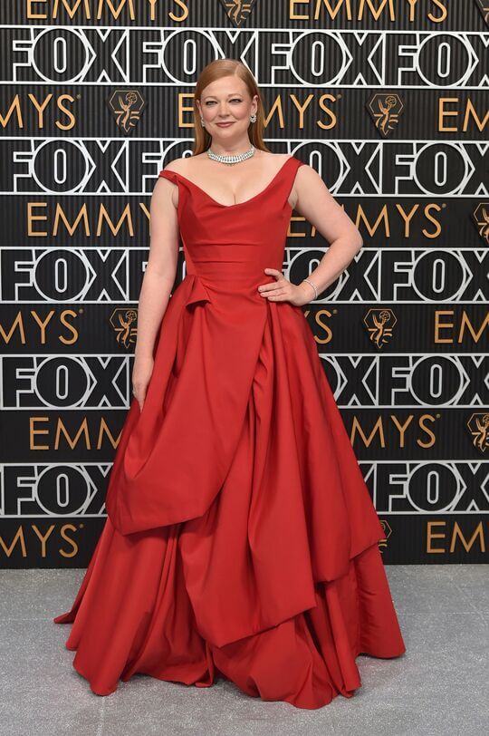 Sarah Snook in a red Vivienne Westwood gown and diamond encrusted Cartier jewels