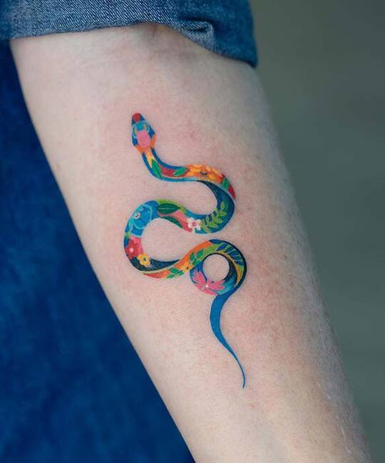 Snake hand tattoo