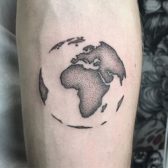 World map tattoo on hand