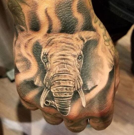 elephant hand tattoo for men