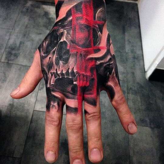 red brush stroke ink over skull hand tattoo for male