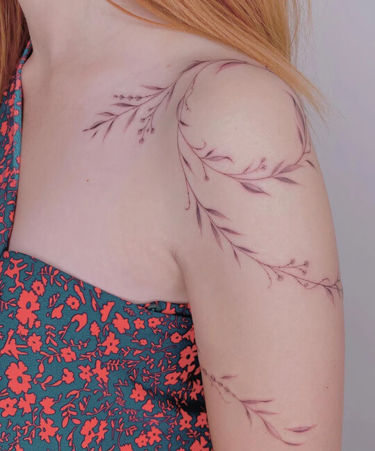 vine tattoo wrapped around shoulder for women